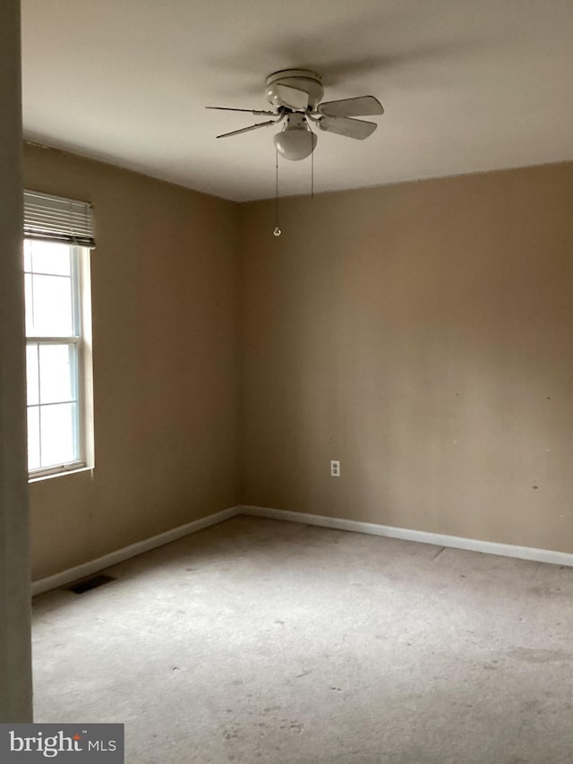 spare room with ceiling fan