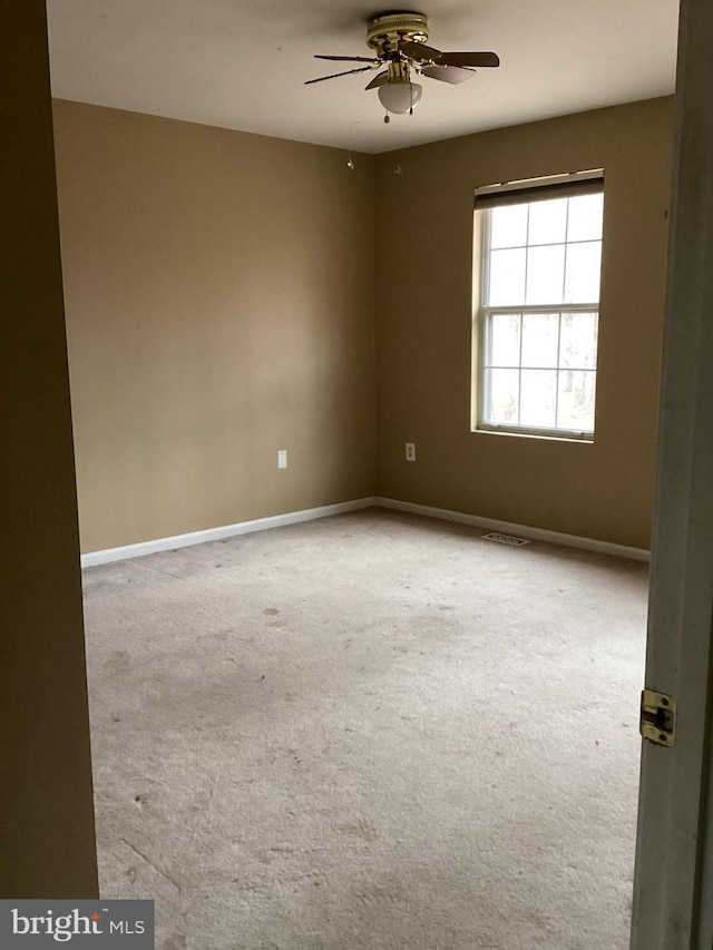 unfurnished room featuring ceiling fan