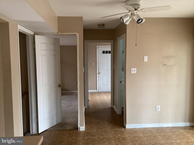 hallway featuring tile patterned flooring