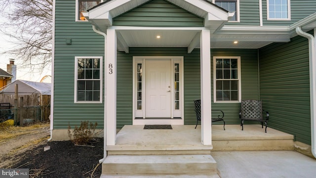 doorway to property with a porch