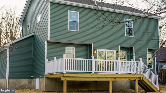 rear view of house with a wooden deck