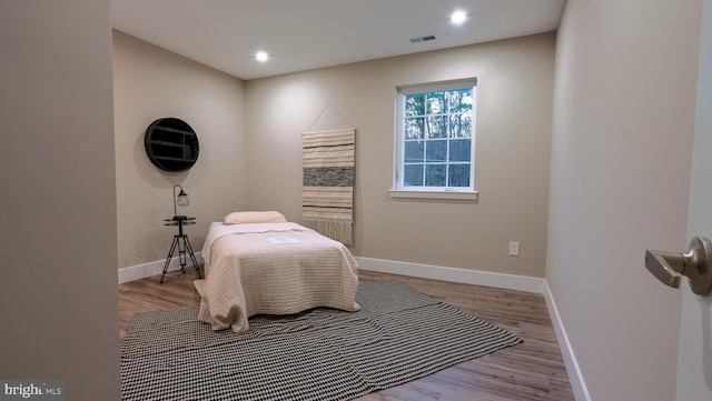 bedroom with light wood-type flooring