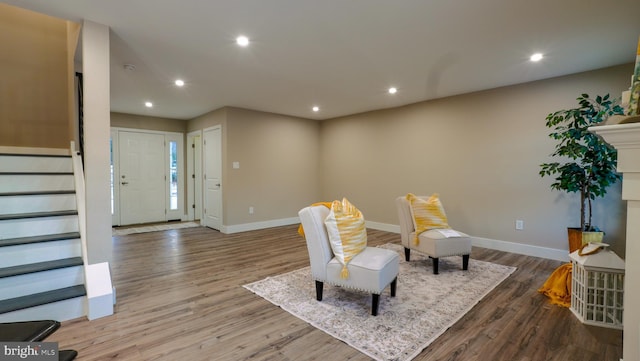 living area with hardwood / wood-style floors