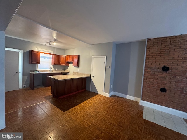 kitchen featuring kitchen peninsula and sink