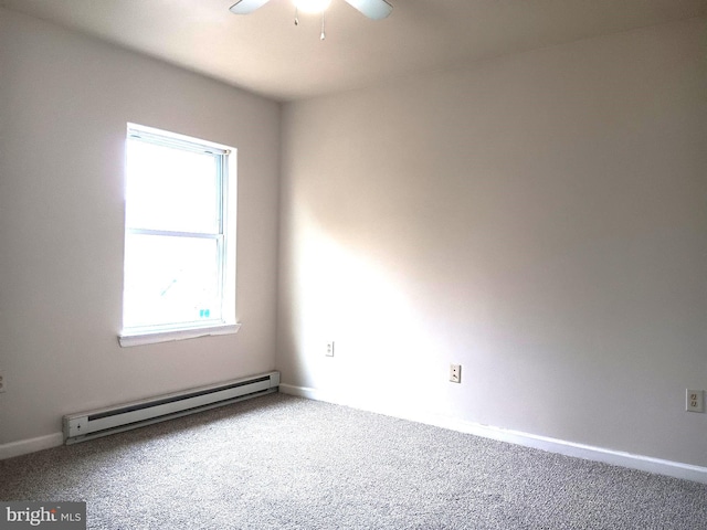 carpeted empty room featuring baseboard heating, ceiling fan, and a healthy amount of sunlight