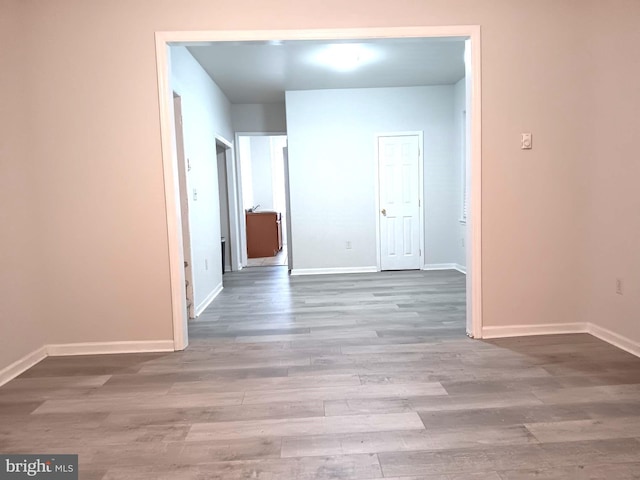 hall with light hardwood / wood-style floors