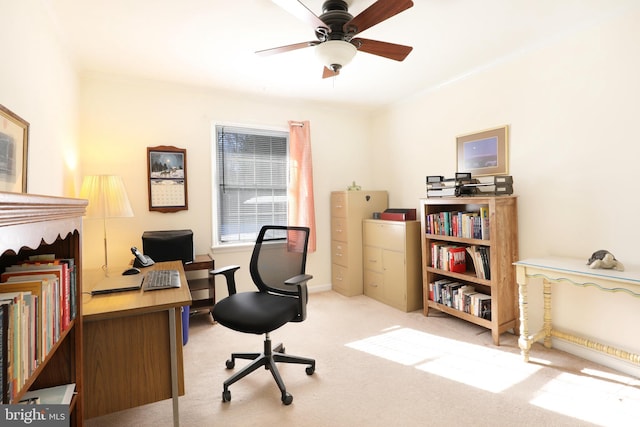 office space with ceiling fan and light carpet