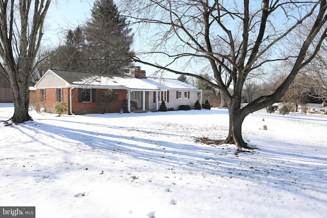 view of snow covered house