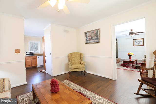 living area featuring crown molding and dark hardwood / wood-style floors