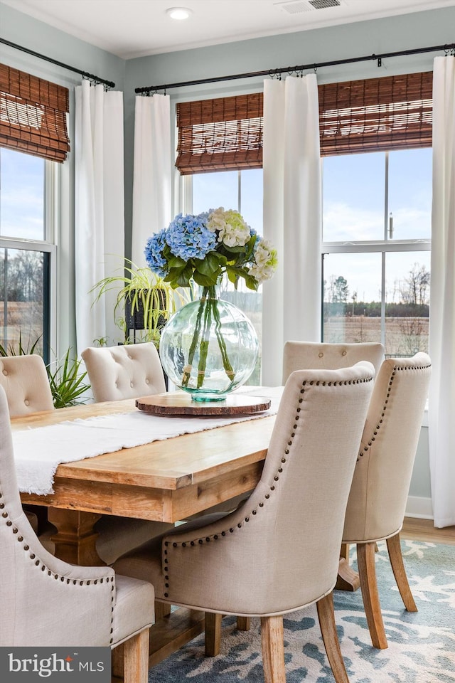 dining area with wood-type flooring