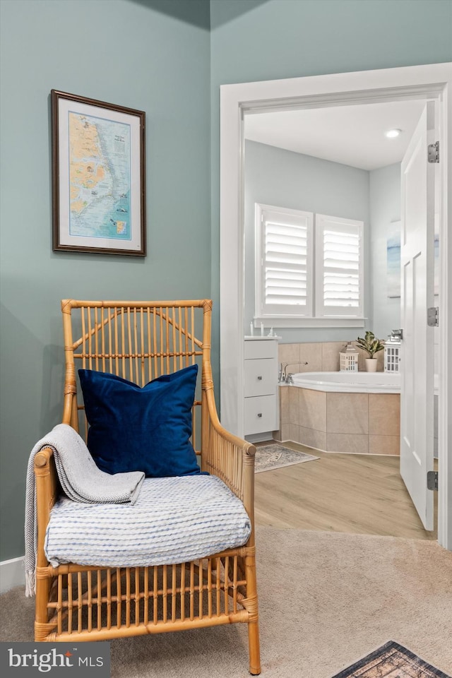 sitting room with light hardwood / wood-style flooring