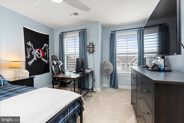 carpeted bedroom featuring ceiling fan