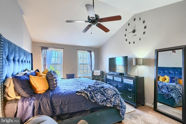 bedroom with ceiling fan, light colored carpet, and vaulted ceiling