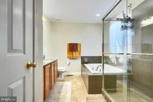 full bathroom featuring vanity, independent shower and bath, and toilet