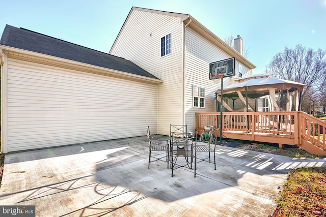 back of house featuring a gazebo, a patio area, and a deck