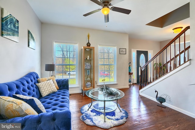 living room with dark hardwood / wood-style floors and ceiling fan