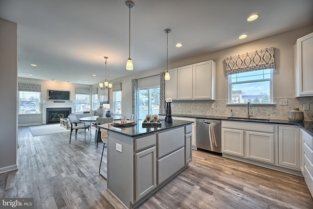 Skyview Dr W, Lavale, MD 21502 - kitchen featuring stainless steel dishwasher, healthy amount of natural light, decorative backsplash, and recessed lighting