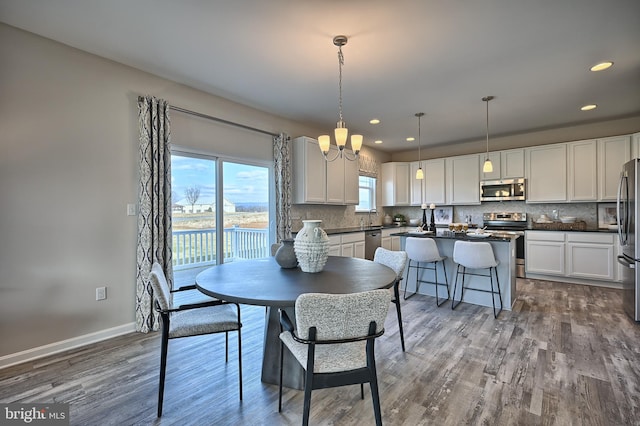 Skyview Dr W, Lavale, MD 21502 - dining space with dark wood-style floors, recessed lighting, and a chandelier