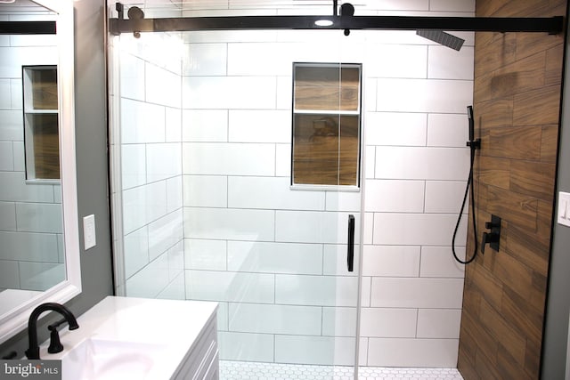 bathroom featuring vanity and a shower with shower door