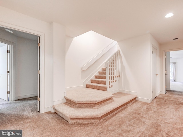 stairway with carpet floors, recessed lighting, and baseboards