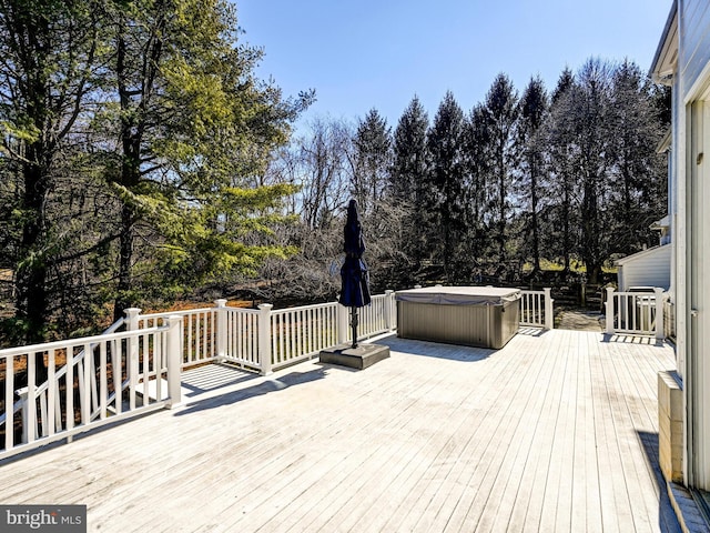 deck with a hot tub