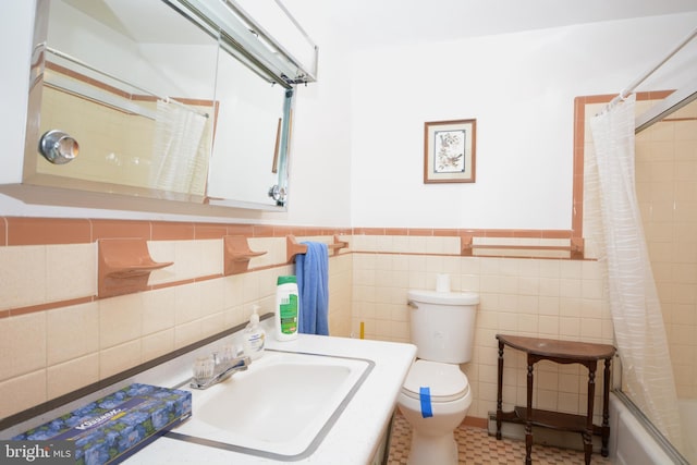 full bathroom with shower / bath combo with shower curtain, sink, tile walls, tile patterned flooring, and toilet