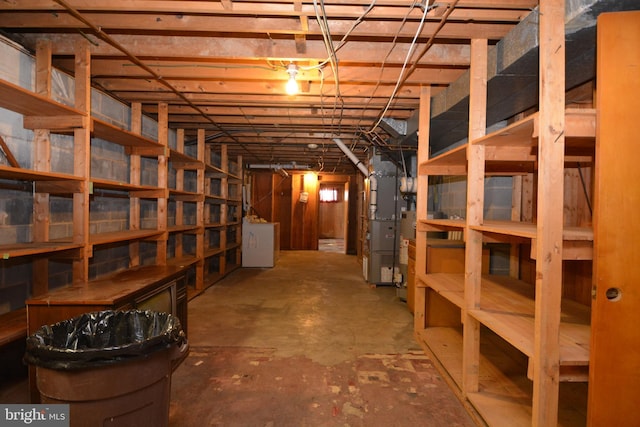 basement featuring washer / dryer and heating unit