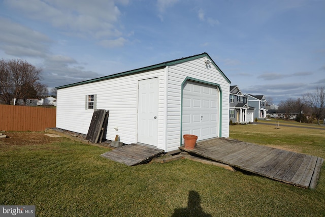 garage featuring a yard