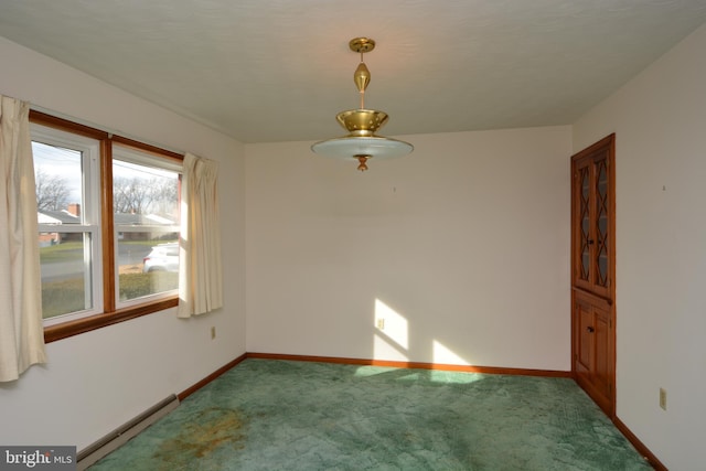 unfurnished room with carpet and a baseboard radiator