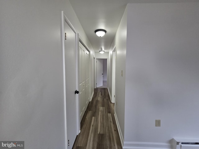 hallway featuring dark hardwood / wood-style flooring