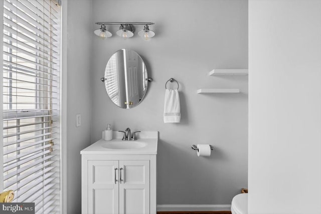 bathroom featuring vanity and toilet