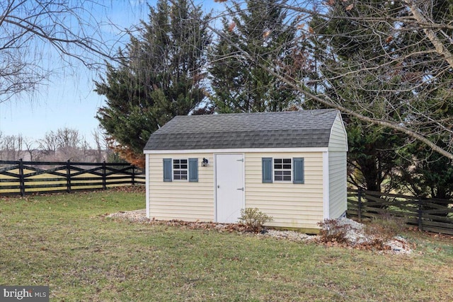 view of outbuilding featuring a yard