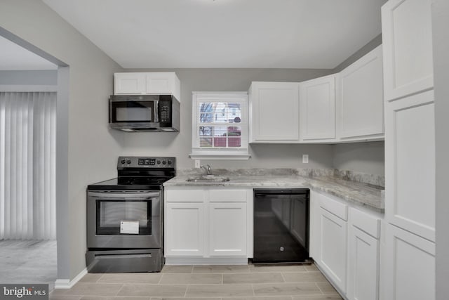 kitchen with white cabinets, sink, and black appliances