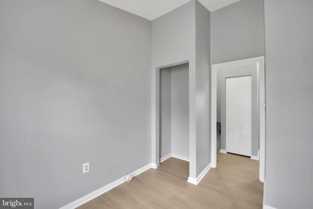 spare room with light hardwood / wood-style flooring