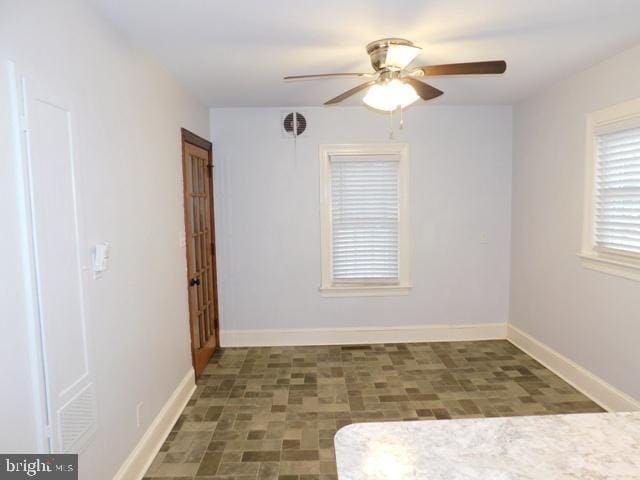 empty room featuring ceiling fan