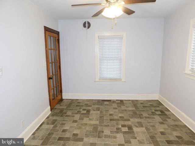 unfurnished room featuring ceiling fan