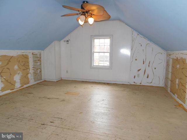 bonus room with ceiling fan and vaulted ceiling