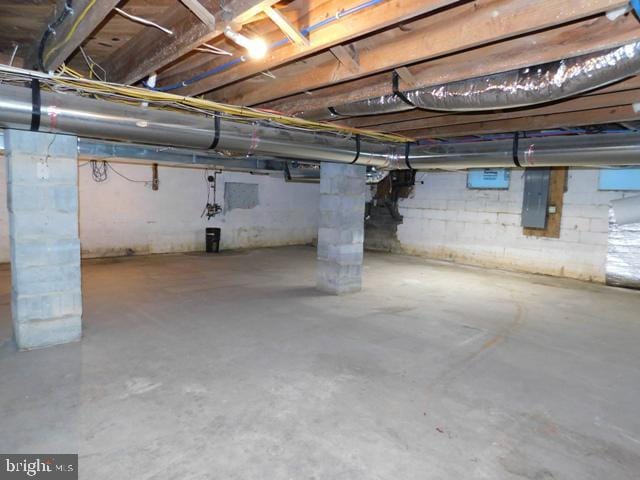 basement featuring electric panel