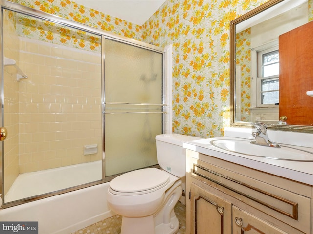 full bathroom with vanity, toilet, and enclosed tub / shower combo