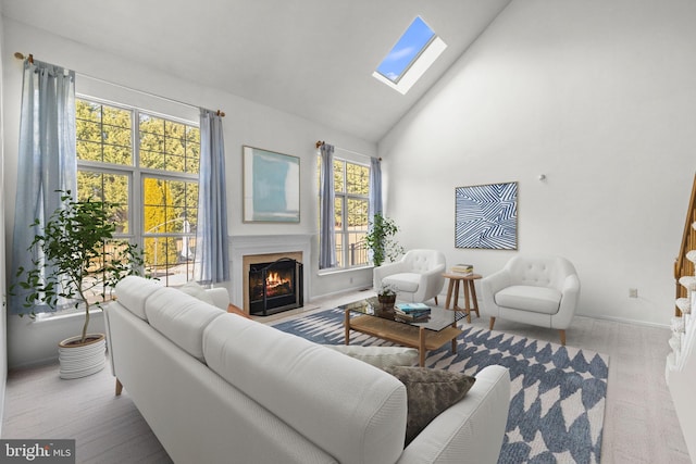 living room with high vaulted ceiling