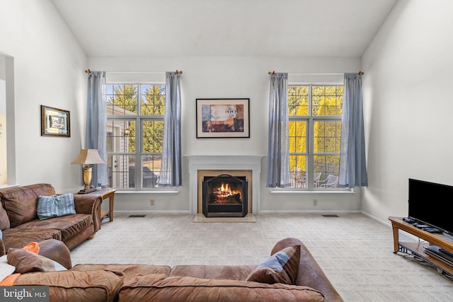 living room featuring a healthy amount of sunlight and light colored carpet