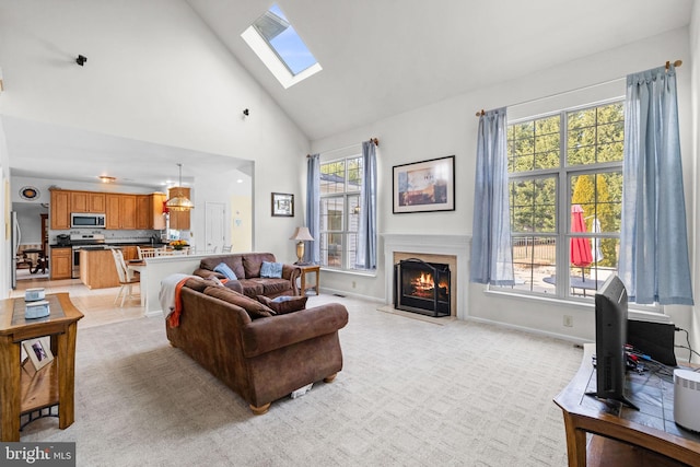 carpeted living room with high vaulted ceiling