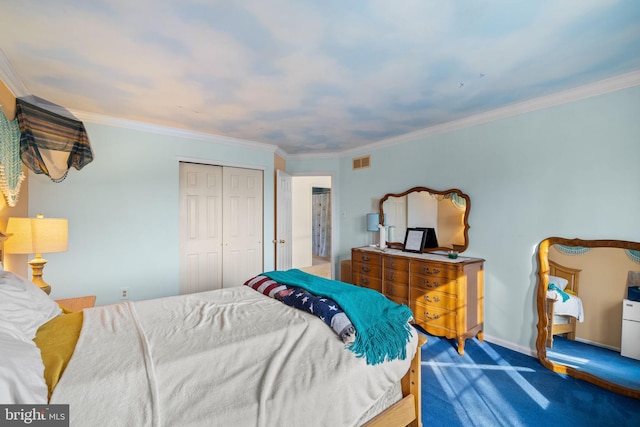 carpeted bedroom featuring a closet and ornamental molding