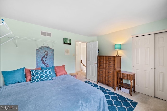 carpeted bedroom with a closet