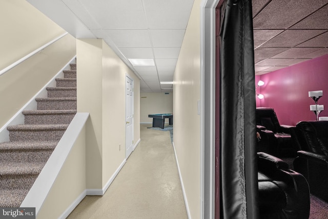 hallway featuring a paneled ceiling