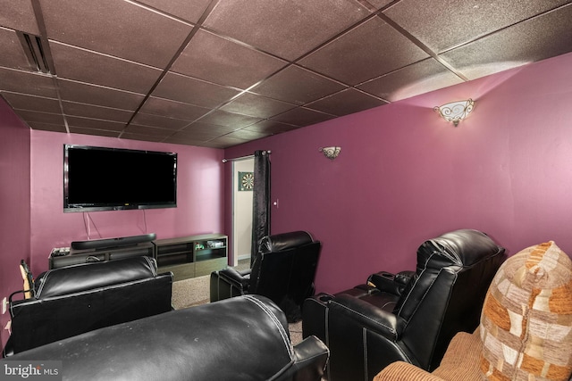 cinema room with a paneled ceiling