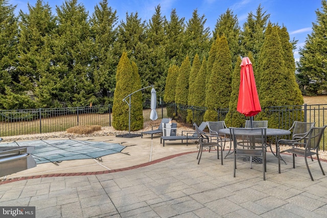 view of patio / terrace featuring a covered pool