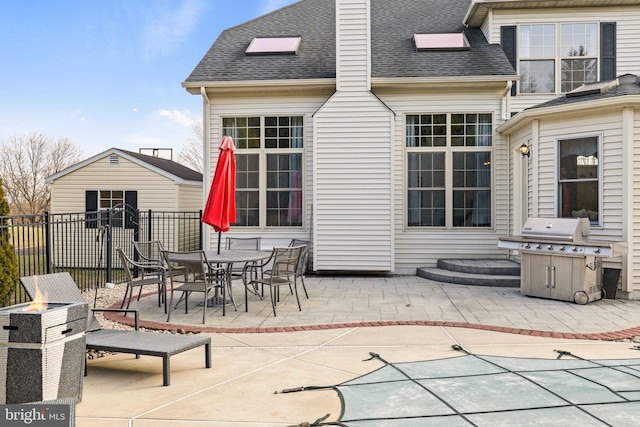 view of patio / terrace featuring a covered pool and grilling area