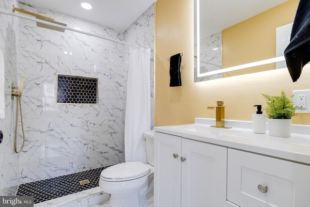 bathroom with vanity, toilet, and walk in shower