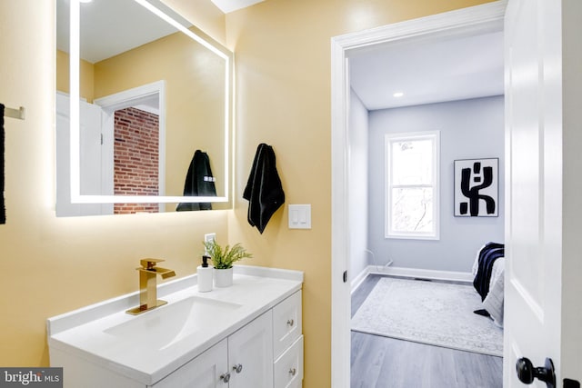 bathroom with vanity and wood-type flooring